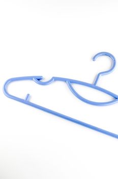 blue plastic clothes hanger on a white background