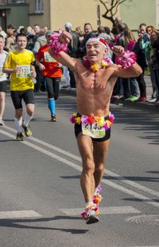 Debno, Poland-April 6, 2014:  Crazy runner on the roads of Debno in the 41th edition of Maraton.