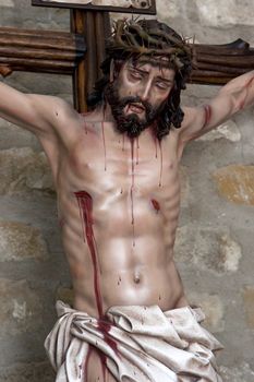 Figure of Jesus on the cross carved in wood by the sculptor Jose Miguel Tirao Carpio, Cristo de las Lluvias, Mengibar, Jaen province, Spain