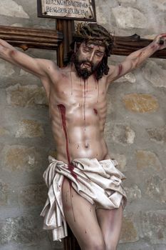 Figure of Jesus on the cross carved in wood by the sculptor Jose Miguel Tirao Carpio, Cristo de las Lluvias, Mengibar, Jaen province, Spain