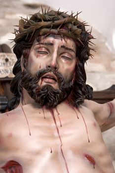 Figure of Jesus on the cross carved in wood by the sculptor Jose Miguel Tirao Carpio, Cristo de las Lluvias, Mengibar, Jaen province, Spain