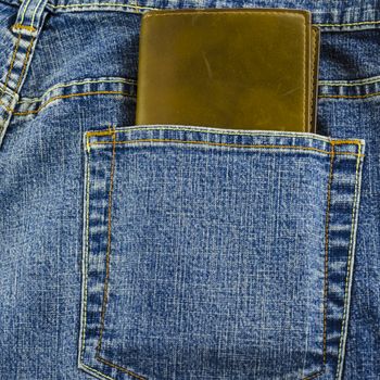 blue jeans pocket with brown wallet