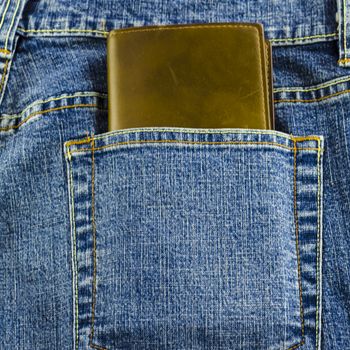 blue jeans pocket with brown wallet