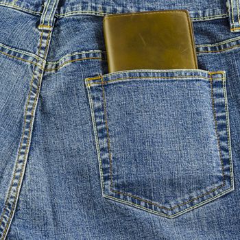 blue jeans pocket with brown wallet