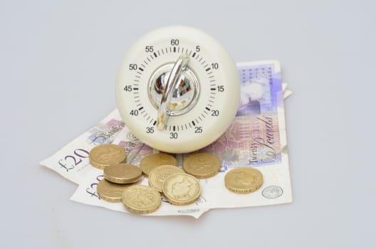 Timer with money lying underneath