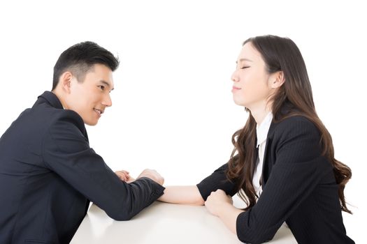 Arm wrestling challenge between a young business man and woman, closeup portrait on white background.