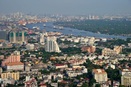 Bangkok city and Chaophraya River from bird's-eye view in evening.