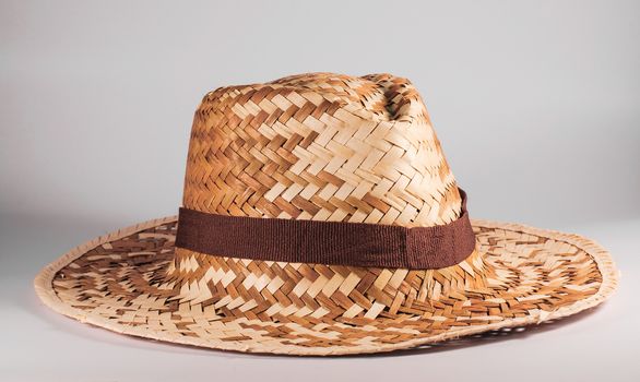 Wood woven hat with a white background