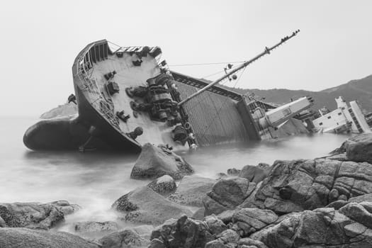 Seascape black and white image of an abandoned ship