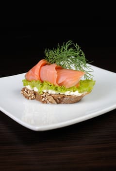 rye bread canapes with salmon and ricotta