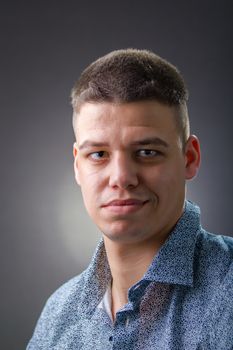 Confident man wearing blue shirt