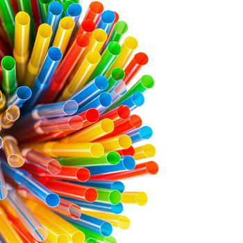 Colored Plastic Drinking Straws with copy-space on a white background