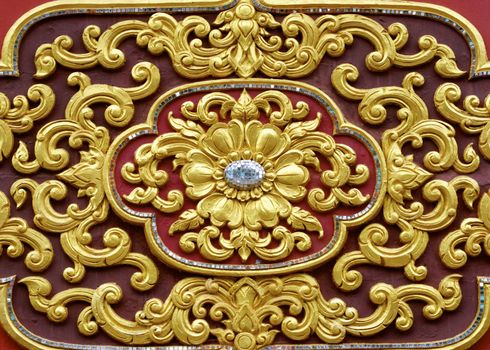 stucco work in thai art that usually decorated with mirror and precious stone or gold leaf,Chiang rai temple,Thailand