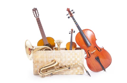 a lot of musical instruments in a box against white background
