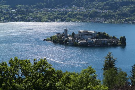 Lake Orta and San Giulio Island and reflection on the water, Piedmont - Italy