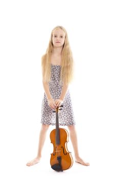 young girl in dress and her violin in studio against white background