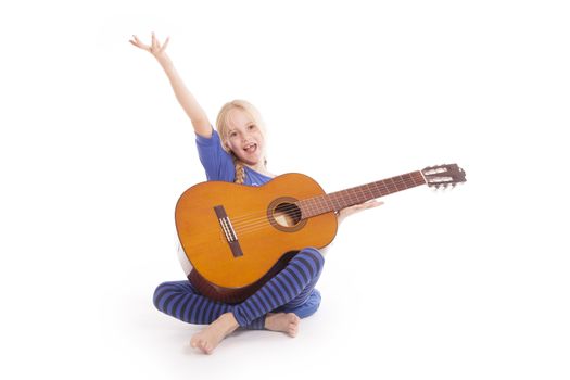 young happy girl with guitar against white background