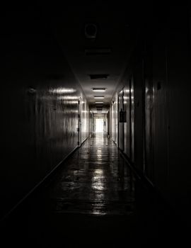 Light through window at dark corridor hallway