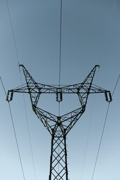 High Voltage Post against blue sky closeup photo