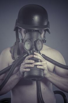 Survival, Man with black gas mask, pollution concept and ecological disaster