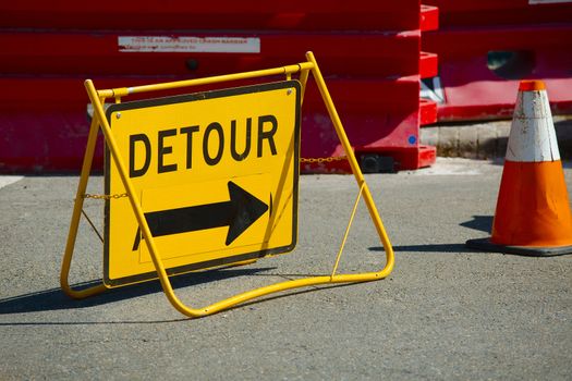 Road construction with detour sign