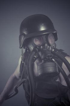 Survival, Man with black gas mask, pollution concept and ecological disaster