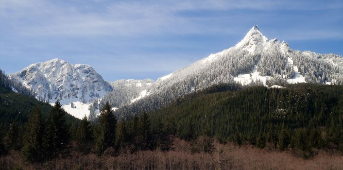 A fresh snow covers the mountains along Interstate 90