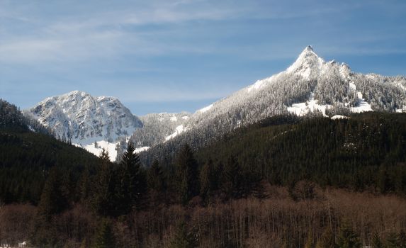 A fresh snow covers the mountains along Interstate 90