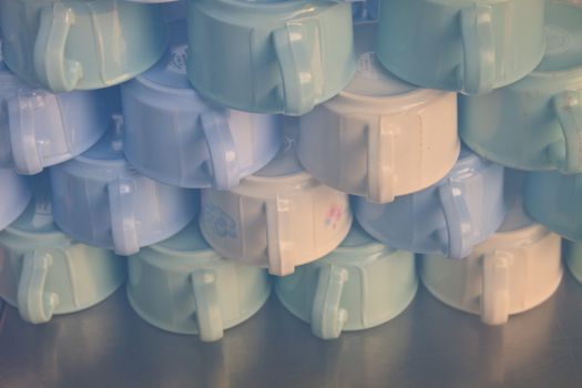 Group of coffee cups, cups for tea piled on table