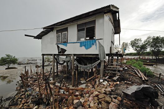 an abandoned shack on a shingle beach