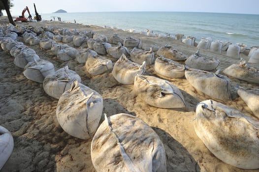 Sand bags along the beach in South of Thailand to protect from heavy surf and erosion.