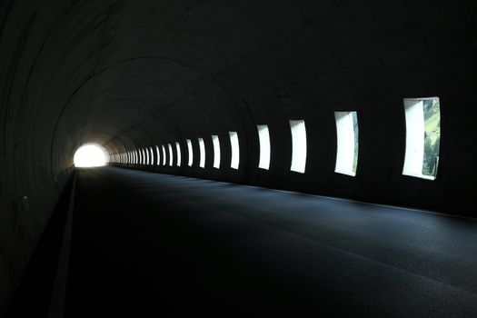 Lights inside a dark road tunnel