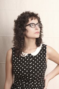 Portrait of a pensive woman in a retro dress.