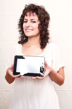 A young woman holding a Tablet PC.