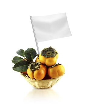 Healthy and organic food concept. Fresh persimmon with flag showing the benefits or the price of fruits.