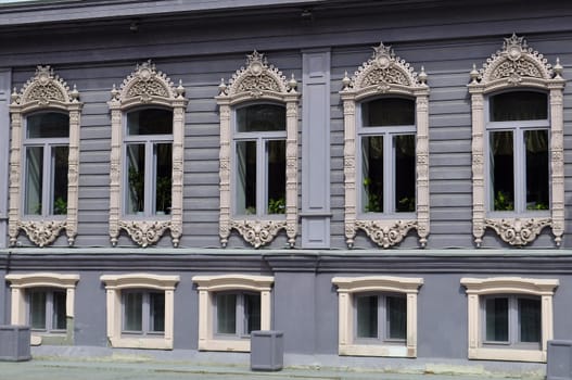 Windows of the house of merchants Chiralov. Architectural monument Tyumen