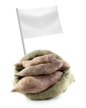 Healthy and organic food concept. Fresh sweet potatoes with flag showing the benefits or the price of fruits.