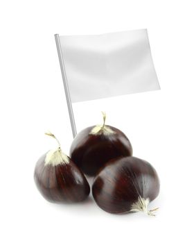 Healthy and organic food concept. Fresh Sweet chestnuts with flag showing the benefits or the price of fruits.