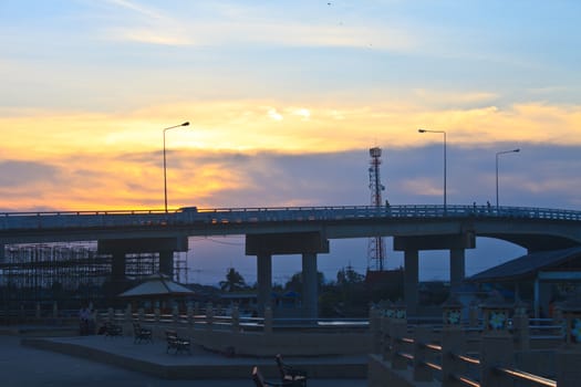 Colorful sunset and Bridge over river in Thailand 