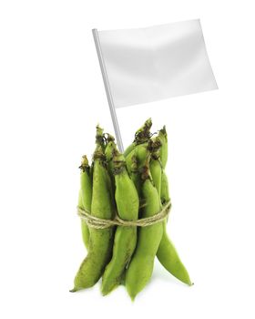 Healthy and organic food concept. Fresh broad bean pods with flag showing the benefits or the price of fruits.
