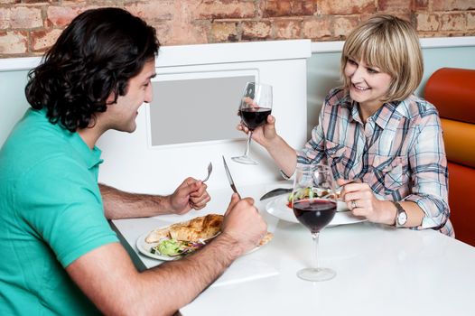 Young couple having dinner at a restaurant