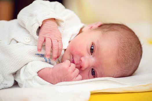 looking with openet eyes newborn baby in the hospital - the first hours of the new life