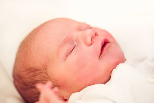 sleeping newborn baby in the hospital - the first hours of the new life