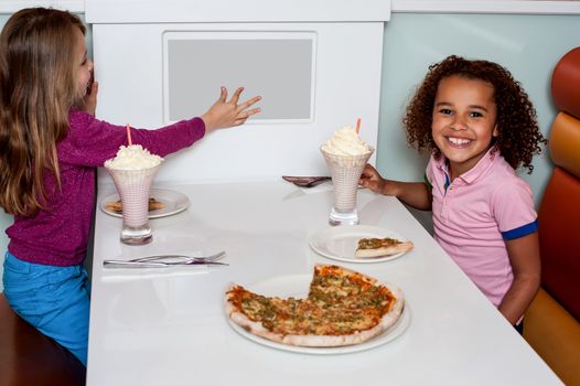 Little girls placing an order through digital menu