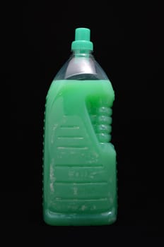 Plastic Green Detergent Bottle on a Black background