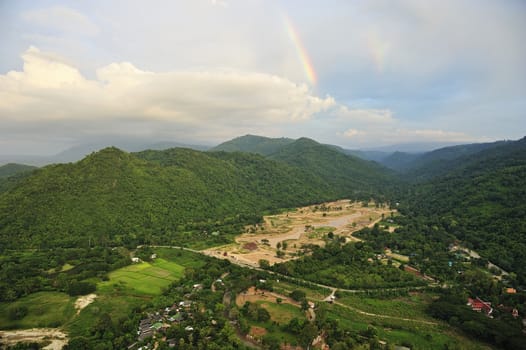 forest destruction with rainbow in thailand form Aerial view