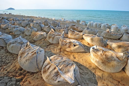 Sand bags along the beach in South of Thailand to protect from heavy surf and erosion.