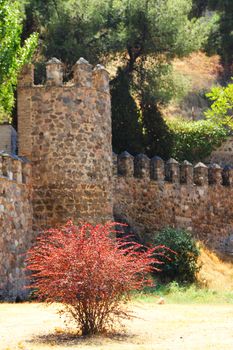 Medieval city walls surrounding the old town of Toledo, Spain.
