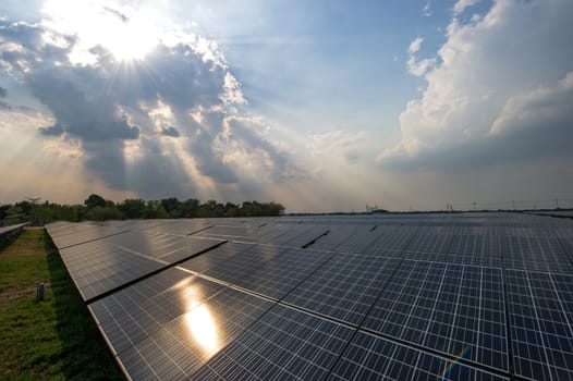 Solar cell over the blue sky and reflect the sun.