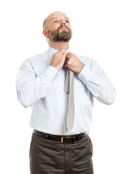 An image of a handsome business man who binding his tie